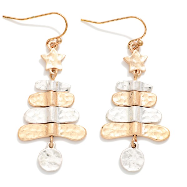Hammered Metal Christmas Tree Drop Earrings featuring stacked, hammered tiers topped with a tiny star and finished with a dangling round ornament charm. The worn, burnished finish gives a rustic, vintage feel that pairs perfectly with sweaters, flannels, and boots. A charming pick for farmhouse and western boutiques, holiday markets, and gift exchanges. Lightweight on fishhook wires, these sell easily as stocking stuffers and impulse adds.