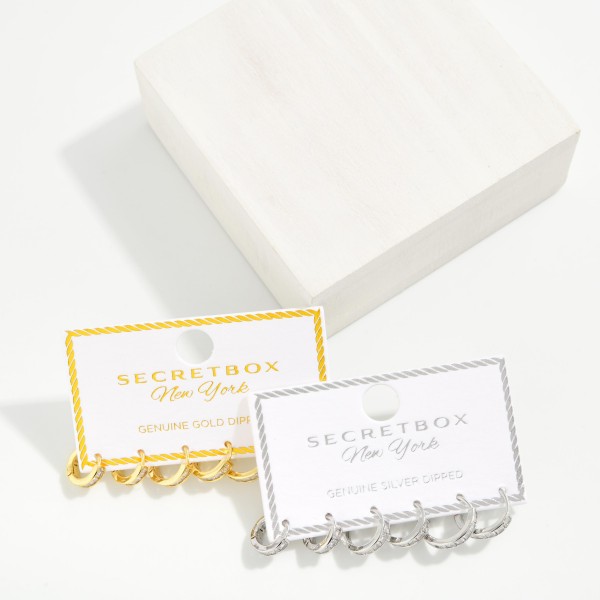 Huggie Hoop Earring Set with three pairs of petite hoops in graduated styles, accented with sparkling cubic zirconia for easy mix and match wear. Hinged closures snap securely and sit close to the ear for comfortable all day wear. Ideal for multiple piercings, layered ear stacks, and everyday polish. Value packed earring sets make a ready to give gift and are a consistent boutique best seller.