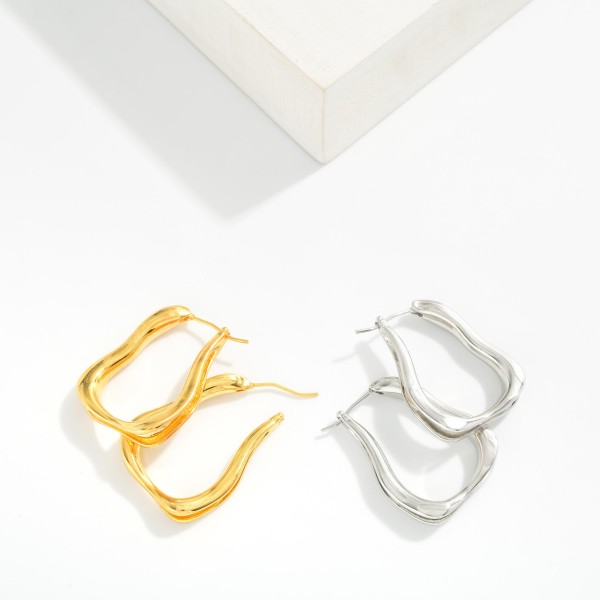 Metal Tone Abstract Hoop Earrings 

- Gold Dipped
- Approximately 2.75" L