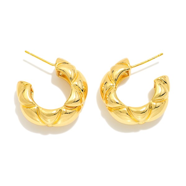 Chunky Twisted Hoop Earrings with a puffy, quilted texture and polished high shine finish. The open C shape and post back keep these bold hoops comfortable for all day wear. An easy everyday statement that pairs with sweaters, tees, and dresses alike. Textured chunky hoops are a year round best seller and a must have basic for any boutique jewelry wall.
