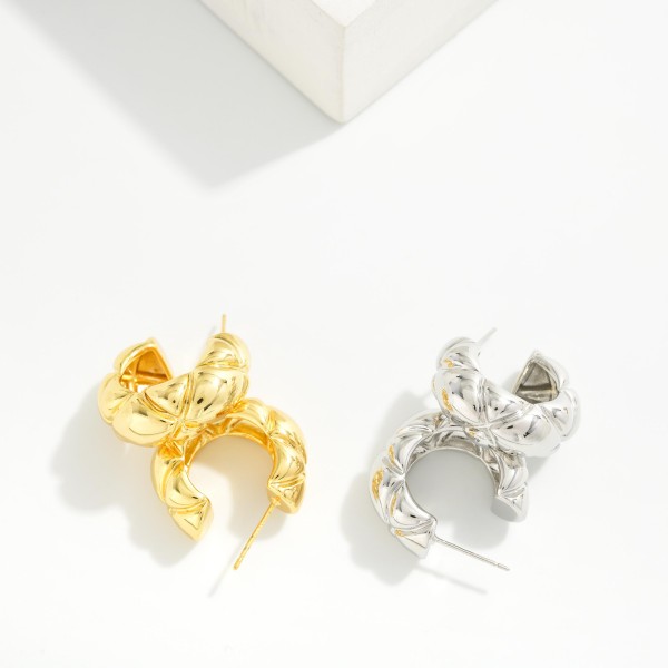 Chunky Twisted Hoop Earrings with a puffy, quilted texture and polished high shine finish. The open C shape and post back keep these bold hoops comfortable for all day wear. An easy everyday statement that pairs with sweaters, tees, and dresses alike. Textured chunky hoops are a year round best seller and a must have basic for any boutique jewelry wall.