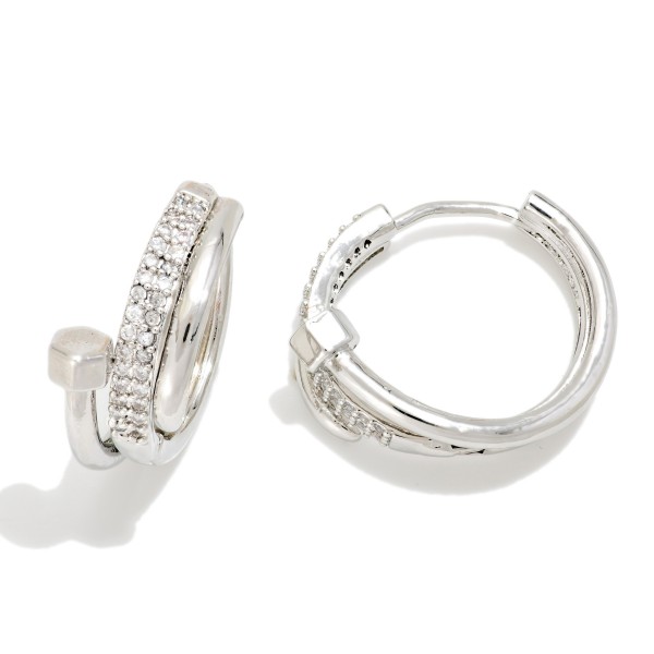 Pave Nail Huggie Hoop Earrings featuring a sleek wraparound nail design with a polished hex head and a row of sparkling cubic zirconia stones along the front. The hinged huggie closure snaps securely and sits close to the ear for a modern, high end look. A trend right gift for birthdays, graduations, and anyone who loves elevated everyday jewelry. Luxe inspired huggies are a strong seller at an accessible price point.