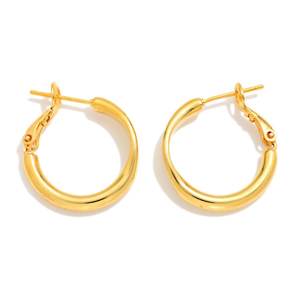 Metal Tone Tube Hoop Earrings Featuring Pressed Metal Detail 

- Gold Dipped
- Approximately .75" D