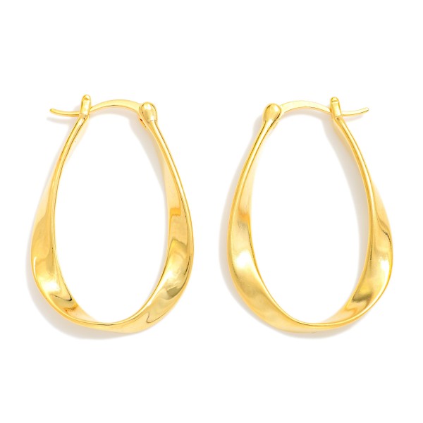 Metal Tone Twisted Flat Oval Hoop Earrings 

- Gold Dipped 
- Approximately 1.25" L X .75" D