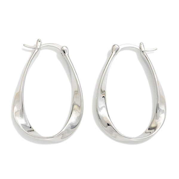 Metal Tone Twisted Flat Oval Hoop Earrings 

- Gold Dipped 
- Approximately 1.25" L X .75" D