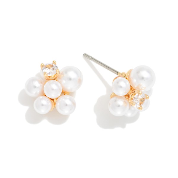 Pearl Cluster Stud Earrings featuring a bouquet of faux pearls in varied sizes accented with a single prong set cubic zirconia stone for a hint of sparkle. The clustered design adds dimension and soft glow while staying lightweight on a secure post. A polished choice for brides, bridesmaids, holiday parties, and everyday elegance. Pearl clusters are a trending bestseller and make an easy, giftable add on at checkout.