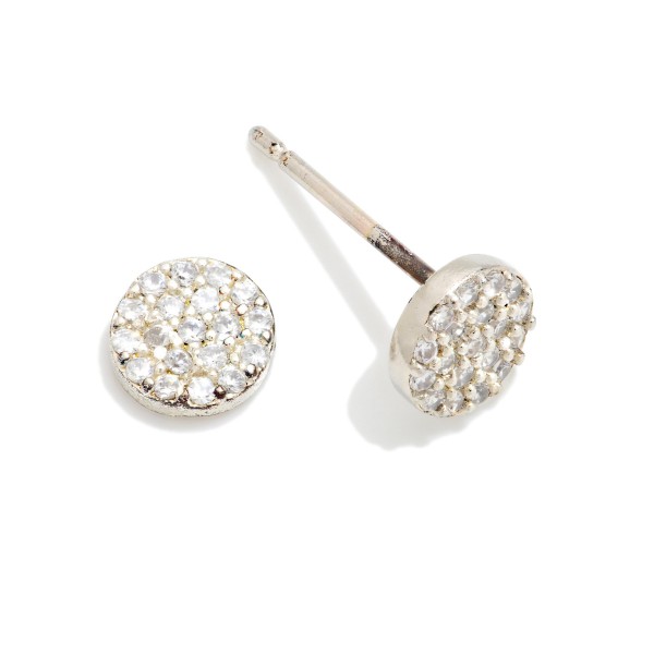 Pave Disc Cubic Zirconia Stud Earrings featuring a petite round disc densely set with sparkling stones for maximum shimmer in a minimal shape. The flat, low profile design sits comfortably against the ear and stacks easily with huggies and climbers. A polished everyday staple that works for the office, weekends, and special occasions alike. Simple sparkle studs make easy gifts and dependable reorders for any boutique jewelry case.
