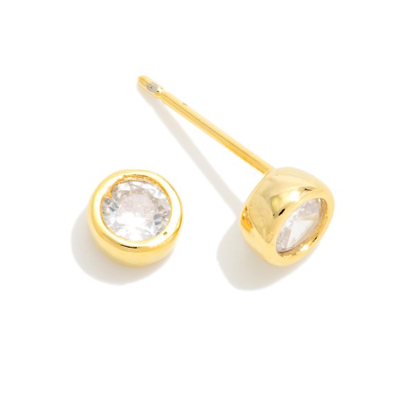 Bezel Set Cubic Zirconia Stud Earrings featuring a brilliant round stone wrapped in a smooth, polished bezel for a clean, modern look. The low profile setting sits close to the ear, stays comfortable for all day wear, and works beautifully in second and third piercings. An everyday essential that pairs with everything and makes an easy gift for birthdays, graduations, and holidays. Classic studs like these are year round staples that reorder again and again.