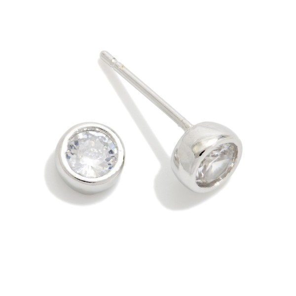 Bezel Set Cubic Zirconia Stud Earrings featuring a brilliant round stone wrapped in a smooth, polished bezel for a clean, modern look. The low profile setting sits close to the ear, stays comfortable for all day wear, and works beautifully in second and third piercings. An everyday essential that pairs with everything and makes an easy gift for birthdays, graduations, and holidays. Classic studs like these are year round staples that reorder again and again.