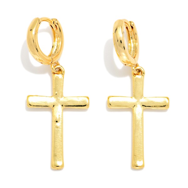 Polished Cross Huggie Drop Earrings featuring a clean, high shine cross dangling from a petite hinged huggie hoop. The simple metal design reads bold yet refined, so it works for church, school, and everyday outfits alike. A meaningful gift for baptisms, confirmations, Easter, and graduation. Classic cross styles remain consistent best sellers, and the huggie base keeps them comfortable for all day wear.