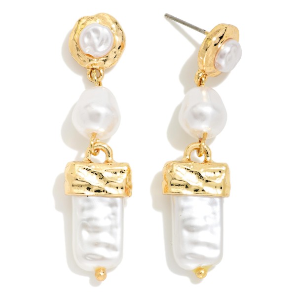 Baroque Pearl Drop Earrings layering a pearl post set in a hammered bezel, an organic faux pearl and an elongated baroque pearl capped in textured metal. The mix of shapes feels modern and artisan while staying light enough for all day wear. Lovely for weddings, holiday parties, church and polished workwear. Pearl statement drops are a steady seller that appeals to every age.