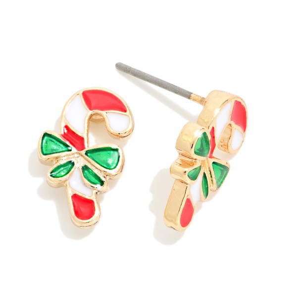 Candy Cane Bow Stud Earrings in glossy enamel with a classic striped cane, a tied bow and a polished metal outline. Small and lightweight on post backs, they are easy to wear every day of the holiday season. Great for Christmas parties, teacher gifts, stocking stuffers and festive work outfits. An easy add on at the register that sells fast all season.