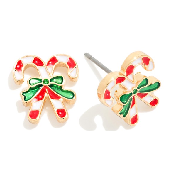 Crossed Candy Cane Stud Earrings in glossy enamel, with two striped canes tied together by a bow and outlined in polished metal. Lightweight post backs keep them comfortable for all day wear through the holidays. Perfect for Christmas parties, school programs, teacher gifts and stocking stuffers. A festive impulse buy that moves fast at the register all season.