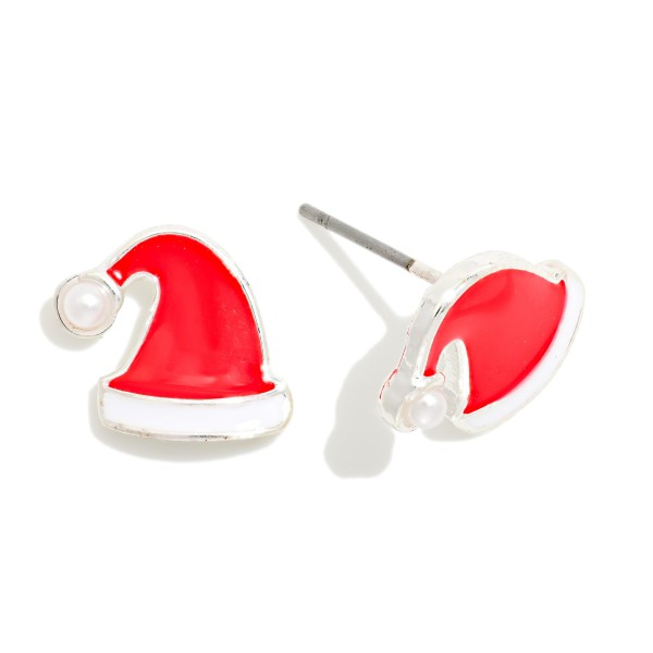 Santa Hat Stud Earrings in glossy enamel with a faux pearl pom pom and polished metal trim. The petite size and post backs make them comfortable for all day wear through the holiday season. Perfect for Christmas parties, school programs, teacher gifts and stocking stuffers. A cheerful impulse buy that sells fast from Thanksgiving through New Year's.