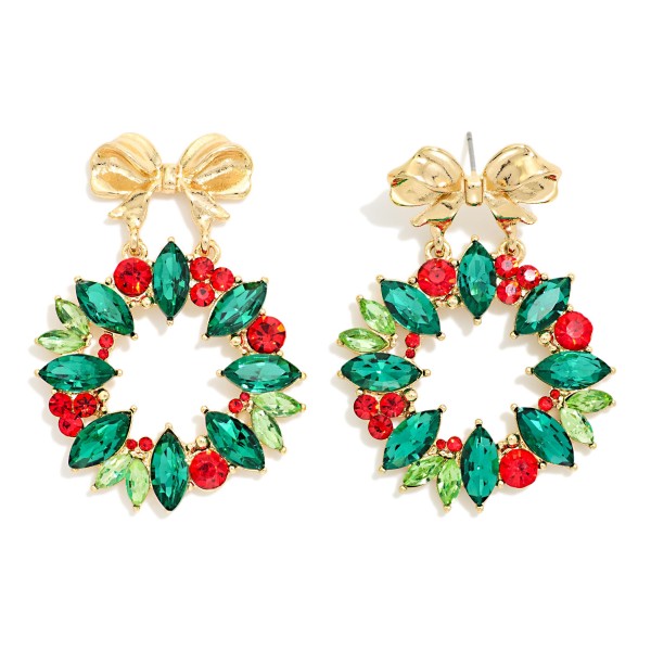 Crystal Christmas Wreath Earrings with a polished bow post top and a round wreath of marquise cut stones dotted with sparkling rhinestone berries. Bold and festive without the weight, they bring instant holiday glam to any outfit. Perfect for Christmas parties, holiday programs, church and family photos. A showstopping seasonal style that sells fast once holiday displays go up.