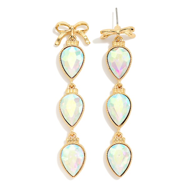 Bow Teardrop Crystal Drop Earrings with a polished bow post top and three faceted pear cut stones linked in delicate bezels. The bow detail meets classic sparkle for a feminine statement that moves with every turn. Made for holiday parties, weddings, birthdays and date nights. Bow details are a shopper favorite right now, and these stand out on any jewelry display.