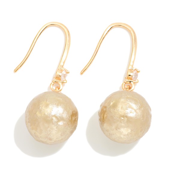 Cotton Pearl Drop Earrings with a soft textured pearl bead and a tiny crystal accent on lightweight fishhook wires. The matte pearl finish feels modern and organic while staying light enough for all day wear. A pretty everyday pick for the office, brunch, weddings and holiday gatherings. Pearl drops are a year round staple that sell to every age.
