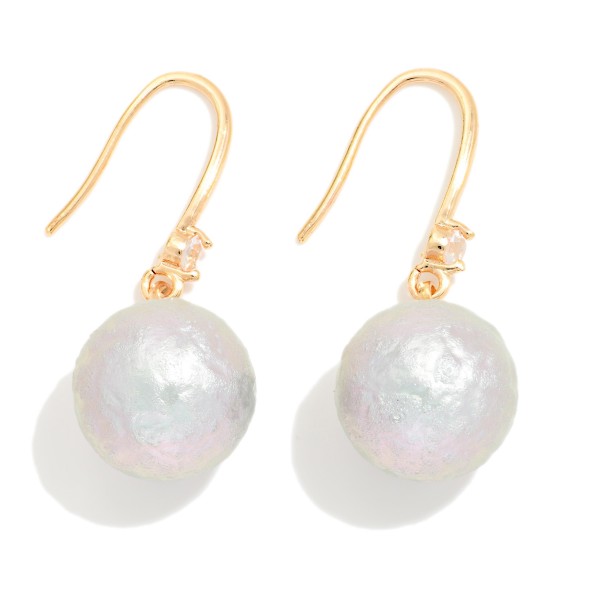 Cotton Pearl Drop Earrings with a soft textured pearl bead and a tiny crystal accent on lightweight fishhook wires. The matte pearl finish feels modern and organic while staying light enough for all day wear. A pretty everyday pick for the office, brunch, weddings and holiday gatherings. Pearl drops are a year round staple that sell to every age.