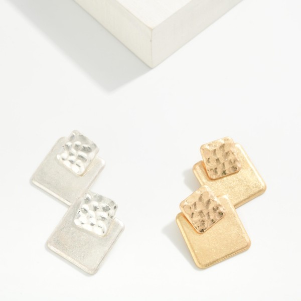 Geometric Square Drop Earrings pairing a small hammered square post with a larger brushed square below for a layered, modern shape. The mix of textures adds interest while the flat profile keeps them light and comfortable. An easy everyday pick for the office, brunch and weekend errands. Clean geometric metal styles appeal to every age and sell steadily all year.