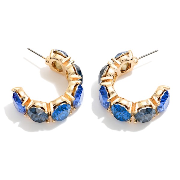 Crystal Hoop Earrings lined with oval faceted stones in polished prong settings for a bold, jeweled open hoop. Post backs keep them secure, and the C hoop shape sits close to the ear for all night comfort. Perfect for holiday parties, weddings, date nights and New Year's Eve. A glam statement hoop that sells fast in every colorway on display.
