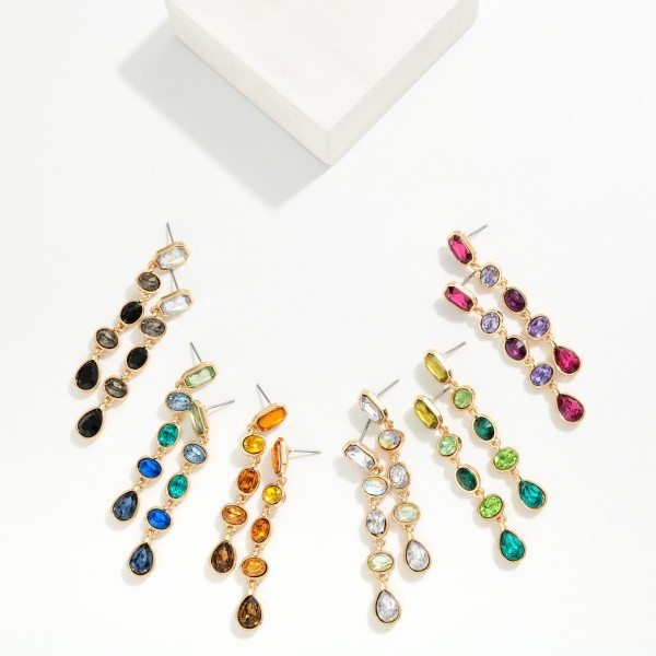 Linear Crystal Drop Earrings stacking five faceted stones in mixed cuts, from a rectangle post top through ovals to a teardrop finish, each set in a polished bezel. They move and sparkle with every turn while staying light enough for all night wear. Made for holiday parties, weddings, galas and New Year's Eve. A head turning statement drop at a price that makes it an easy add on.