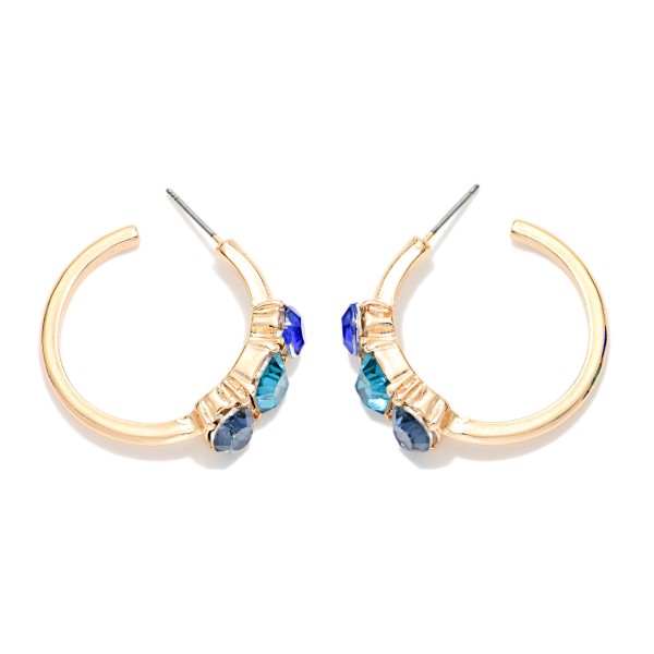 Crystal Accent Hoop Earrings with a polished open hoop and a cluster of three faceted stones set in raised bezels along the front. Post backs and a lightweight build keep them comfortable from morning to night. A pretty upgrade for holiday parties, date nights and everyday sparkle. Jeweled hoops are a seasonal favorite, and this pair sells at an easy impulse price.