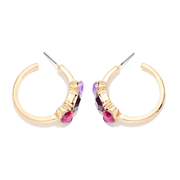 Crystal Accent Hoop Earrings with a polished open hoop and a cluster of three faceted stones set in raised bezels along the front. Post backs and a lightweight build keep them comfortable from morning to night. A pretty upgrade for holiday parties, date nights and everyday sparkle. Jeweled hoops are a seasonal favorite, and this pair sells at an easy impulse price.