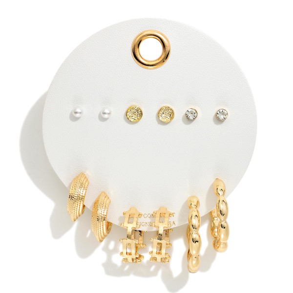 Textured Stud and Huggie Earring Set with six pairs on one card: faux pearl, textured disc, and crystal studs, plus ribbed, chain link drop, and twisted huggie hoops. The variety makes it easy to style a curated ear stack or switch looks day to day. A thoughtful gift for birthdays, holidays, and teacher appreciation. Lead compliant and packed with value, multi pair cards like this sell through quickly at boutique checkout counters.