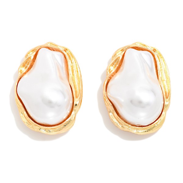 Baroque Pearl Stud Earrings featuring an organic shaped faux pearl framed in a sculpted metal bezel. The irregular pearl gives each pair a modern, artisan look while keeping the classic appeal of pearls. Post backs for secure, comfortable wear. An elegant everyday stud that also works for weddings, showers, and gifting, and pairs well with the coordinating baroque pearl necklace.