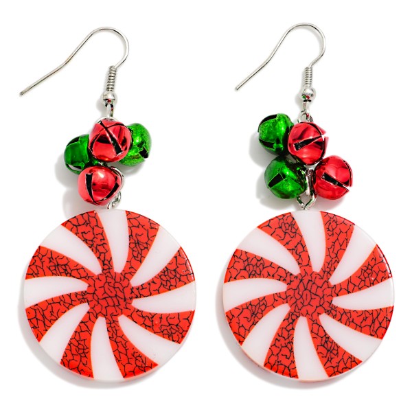 Peppermint Candy Drop Earrings featuring a swirled peppermint disc with a crackle finish, topped with a cluster of mini jingle bells that chime softly with every move. Lightweight fishhook wires keep them easy to wear through long holiday parties. A sweet, nostalgic pick for cookie swaps, school events, and Christmas photos. Playful and giftable, these candy inspired earrings are an easy seasonal bestseller.