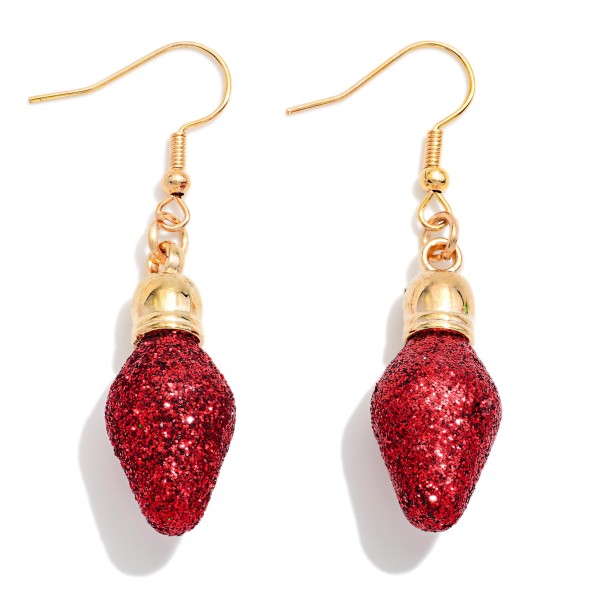 Glitter Christmas Light Bulb Drop Earrings shaped like a vintage string light, with a sparkling glitter bulb and a polished metal cap on lightweight fishhook wires. Simple, playful, and easy to wear, they add a festive pop to sweaters, flannels, and party looks. A crowd favorite for ugly sweater parties, light tours, and holiday events. Classic, nostalgic, and budget friendly, these are an easy impulse buy that sells all season.
