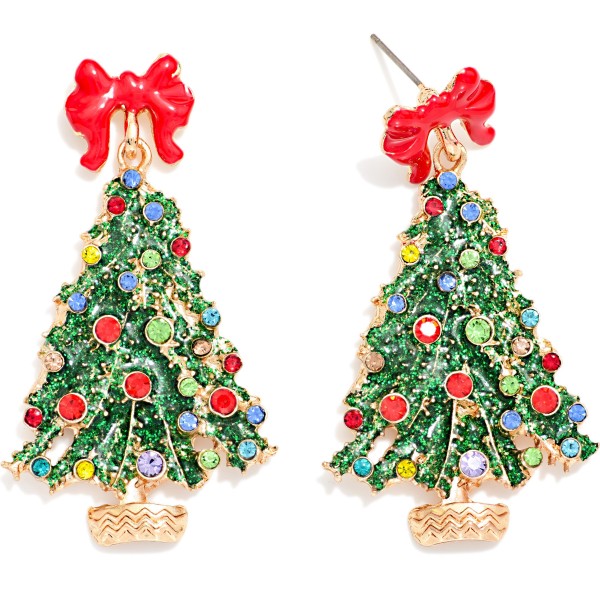 Glitter Christmas Tree Drop Earrings topped with an enamel bow post and covered in sparkling rhinestone ornaments from top to bottom. Glitter enamel branches and a polished woven basket base give this tree a rich, vintage inspired look, while secure posts keep them comfortable through long holiday events. A dressy option for Christmas parties and church services that photographs beautifully. Bows and sparkle are trending this season, so expect these to turn fast.