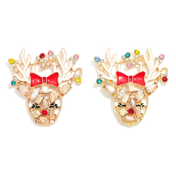Christmas Reindeer Stud Earrings featuring a sparkling rhinestone reindeer face with enamel accents, a sweet bow, and antlers dotted with tiny crystals. Post backs keep them secure and comfortable for all day holiday wear. A playful pick for Christmas parties, ugly sweater days, and classroom celebrations. Holiday earrings sell fast from November through December, making these an easy impulse buy at the register.