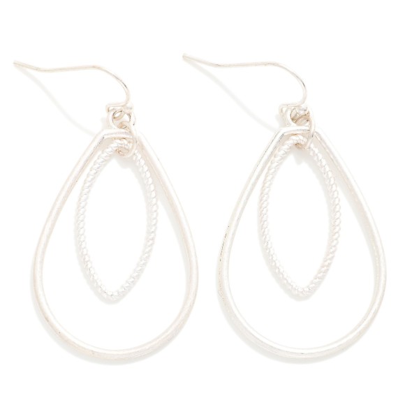 Textured Teardrop Drop Earrings featuring an open teardrop frame with a beaded marquise shape layered inside. The nested silhouette creates dimension and catches the light with every turn. Lightweight fishhook wires keep them comfortable all day. An elegant everyday earring that dresses up a simple outfit, perfect for work, church, and weekend wear.
