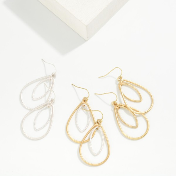 Textured Teardrop Drop Earrings featuring an open teardrop frame with a beaded marquise shape layered inside. The nested silhouette creates dimension and catches the light with every turn. Lightweight fishhook wires keep them comfortable all day. An elegant everyday earring that dresses up a simple outfit, perfect for work, church, and weekend wear.