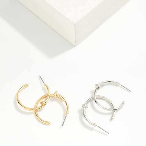Slim Knot Hoop Earrings with a smooth open hoop finished with a delicate knotted detail. The subtle twist updates a classic hoop and keeps it light and easy for everyday wear. Post backs for a secure, comfortable fit. A simple, polished earring that works for the office, weekends, and gifting, and pairs nicely with the coordinating knot bangles.