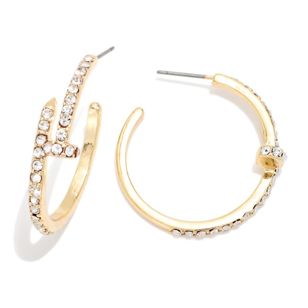 Rhinestone Accent Hoop Earrings featuring an open hoop with a sparkling pave detail along the front and a textured edge. The rhinestone accent gives a classic hoop extra shine for evenings, holidays, and special events. Post backs for a secure, comfortable fit. A dressy hoop style at an accessible price that makes an easy gift and coordinates with other sparkle pieces on your display.