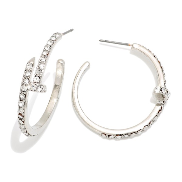 Rhinestone Accent Hoop Earrings featuring an open hoop with a sparkling pave detail along the front and a textured edge. The rhinestone accent gives a classic hoop extra shine for evenings, holidays, and special events. Post backs for a secure, comfortable fit. A dressy hoop style at an accessible price that makes an easy gift and coordinates with other sparkle pieces on your display.