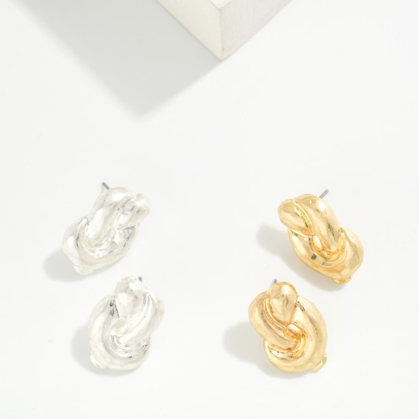 Chunky Knot Stud Earrings with a sculpted, puffy knot design in a soft brushed metal finish. The bold, dimensional shape makes a statement while staying close to the ear. Post backs for secure, comfortable wear. A polished everyday earring that works with casual and dressy looks, and a dependable seller for customers who love chunky metal styles.