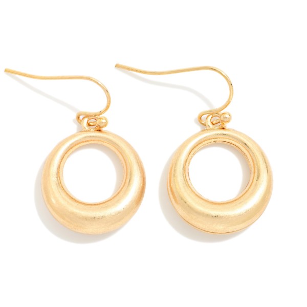Organic Circle Drop Earrings with a sculpted open ring in a soft brushed finish, hanging from simple fishhook wires. The smooth, rounded shape feels modern and effortless for everyday wear. Lightweight enough for all day comfort. A versatile metal earring at an easy price point that pairs with any outfit and sells well as an impulse purchase near the register.