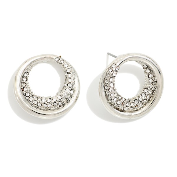 Pave Open Circle Stud Earrings featuring a sculpted ring with a crescent of sparkling rhinestones. The rounded, dimensional shape catches the light from every angle while staying close to the ear. Post backs keep them secure and comfortable for all day wear. An elegant everyday stud that dresses up for weddings and holiday events, perfect for customers who want shine without the weight of a drop earring.