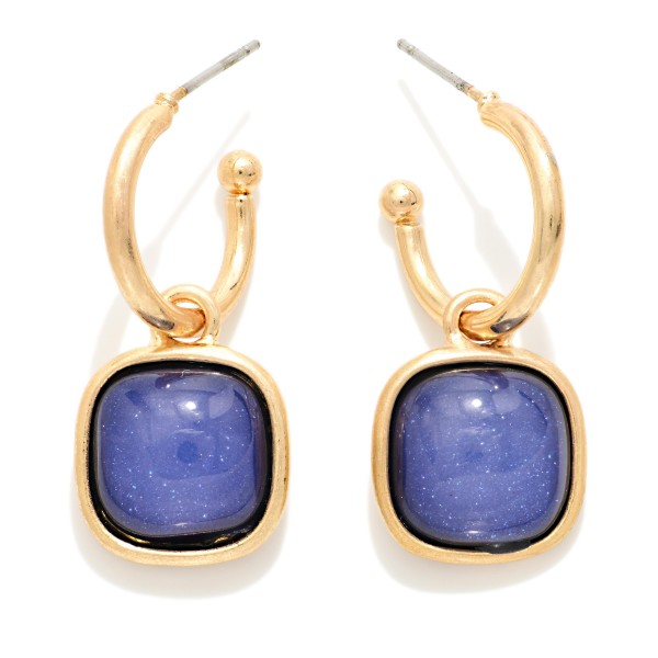 Cushion Stone Hoop Charm Earrings with a framed square cabochon stone that dangles from a polished open hoop. The bold stone and clean metal pairing makes these an easy statement for holiday parties, date nights, and dressing up everyday outfits. Lightweight post backs for comfortable wear. Offered in several stone options, they're a natural upsell alongside the coordinating square stone necklaces and bracelets.