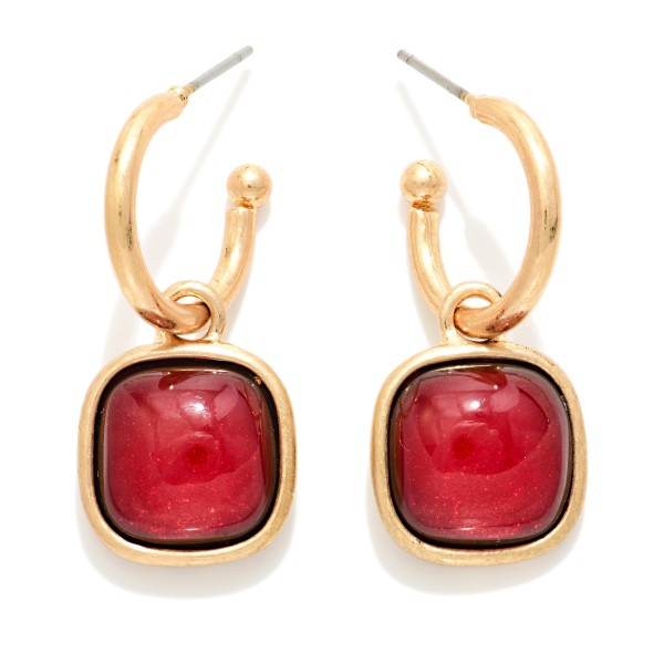 Cushion Stone Hoop Charm Earrings with a framed square cabochon stone that dangles from a polished open hoop. The bold stone and clean metal pairing makes these an easy statement for holiday parties, date nights, and dressing up everyday outfits. Lightweight post backs for comfortable wear. Offered in several stone options, they're a natural upsell alongside the coordinating square stone necklaces and bracelets.
