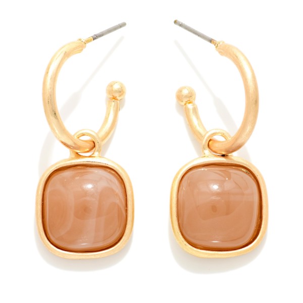 Square Stone Hoop Drop Earrings featuring glossy cushion cut cabochon stones framed in polished metal and suspended from chunky open hoops. The swirled glass stones have a rich, vintage inspired look that adds instant polish to any outfit. Lightweight post backs make them comfortable for all day wear. A coordinating style for the square stone necklaces and bracelets, ideal for building complete looks on your display.