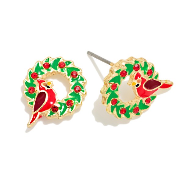 Cardinal Wreath Stud Earrings featuring a sweet enamel cardinal perched inside a holly wreath dotted with sparkling rhinestone berries. Lightweight posts keep them comfortable for all day wear, and the open wreath shape reads clearly from across the room. Cardinals carry special meaning for many shoppers as a sign of loved ones nearby, which makes these a thoughtful keepsake gift. Charming and priced for impulse buys, they are a natural fit for any Christmas display.