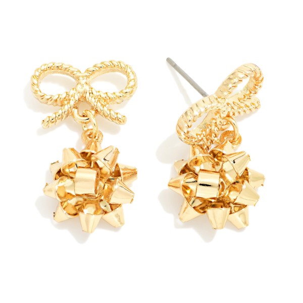 Christmas Gift Bow Drop Earrings featuring a textured rope bow post with a festive present style bow dangling below. Lightweight construction keeps them comfortable through holiday parties, school programs, and family gatherings. A playful pick for teachers, ugly sweater nights, and gift exchanges. Seasonal earrings like these sell through quickly from November into December, so they are a smart early stock up.