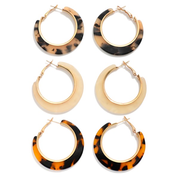 Crescent Acetate Hoop Earring Set with three pairs of chunky crescent hoops in classic tortoiseshell and solid acetate finishes. Each pair tapers from bold to slim around a polished metal hoop with a secure click top closure, giving a sculpted, modern shape that stays light enough for all day wear. Easy to style with sweaters, denim, and fall layers. A three pair set at an approachable price makes this an easy add on that shoppers grab for themselves or tuck into a gift.
