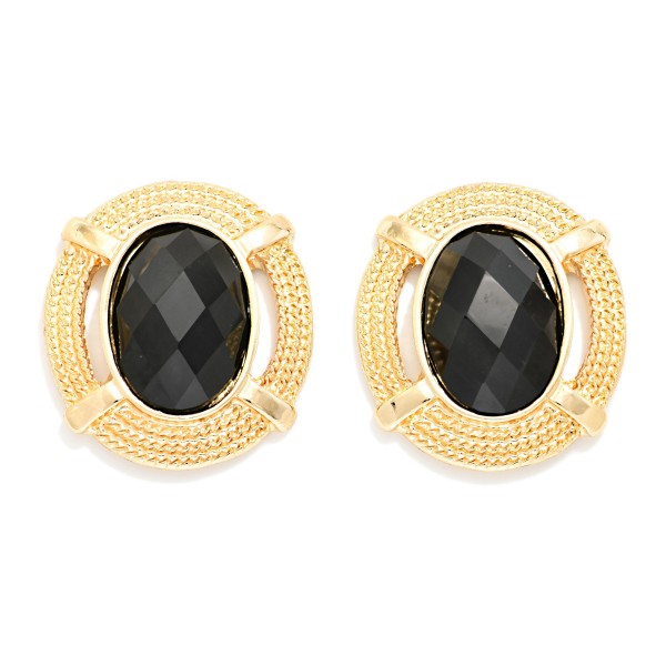 Oval Stone Statement Stud Earrings featuring a faceted oval cabochon set in a textured round metal frame with notched detailing. The decorative border adds vintage charm while the stone delivers rich, polished shine. Lightweight post backs make them comfortable from morning meetings through evening plans. Framed stone studs are a standout fall look and an easy upsell for customers building a curated earring wardrobe.