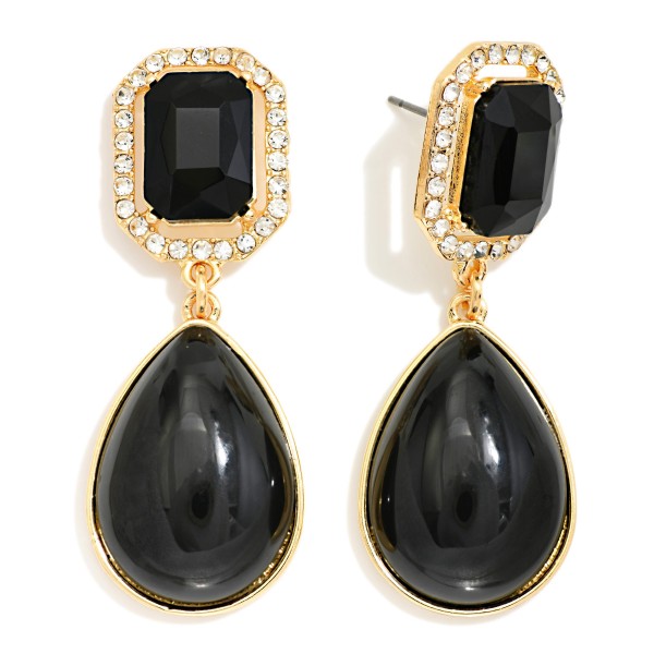 Crystal Halo Teardrop Statement Earrings with a rectangular step cut glass stone framed by a ring of sparkling rhinestones, suspending a glossy teardrop cabochon below. The mix of faceted sparkle and smooth polished drop gives an elegant, old Hollywood feel for weddings, holiday parties, and date nights. Post backs and a balanced weight keep them comfortable all evening. Glam drop earrings are a seasonal must have, and this design delivers a luxe look at a price that makes it an easy gift.