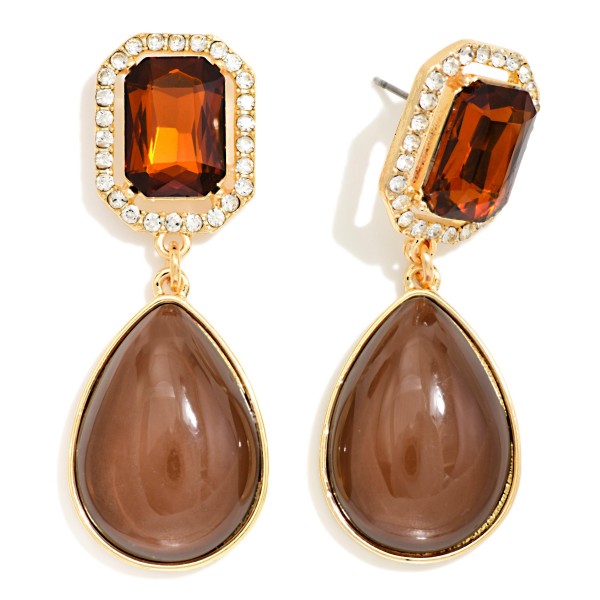 Crystal Halo Teardrop Statement Earrings with a rectangular step cut glass stone framed by a ring of sparkling rhinestones, suspending a glossy teardrop cabochon below. The mix of faceted sparkle and smooth polished drop gives an elegant, old Hollywood feel for weddings, holiday parties, and date nights. Post backs and a balanced weight keep them comfortable all evening. Glam drop earrings are a seasonal must have, and this design delivers a luxe look at a price that makes it an easy gift.